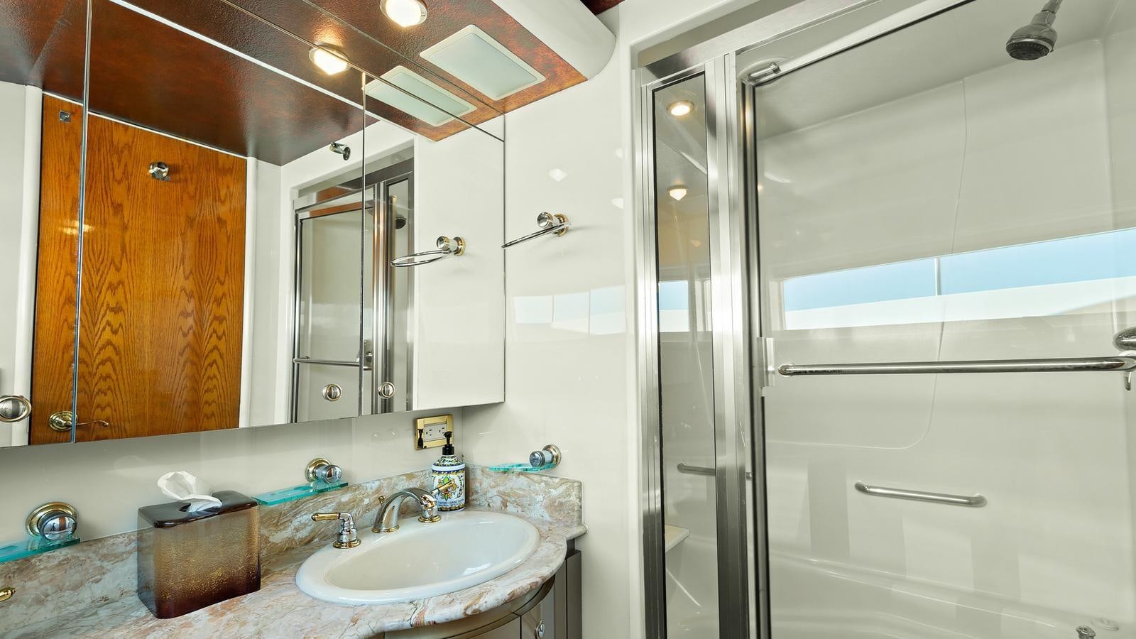 a bathroom with a sink and a mirror aboard ANGELICA Yacht for Sale