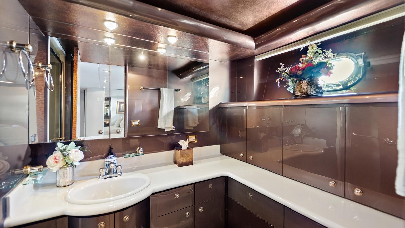 a bathroom with a large mirror aboard ANGELICA Yacht for Sale