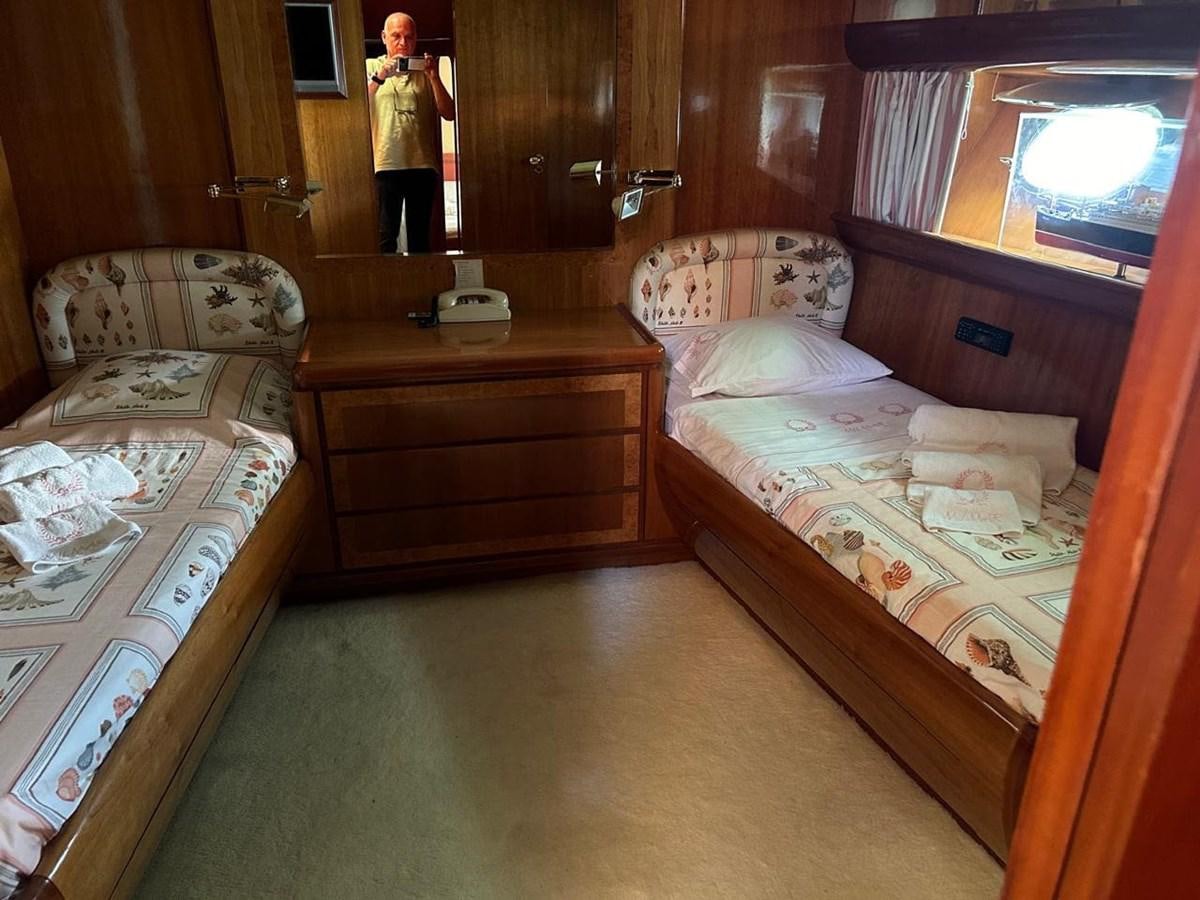 a couple of beds in a room aboard MILMAR Yacht for Sale