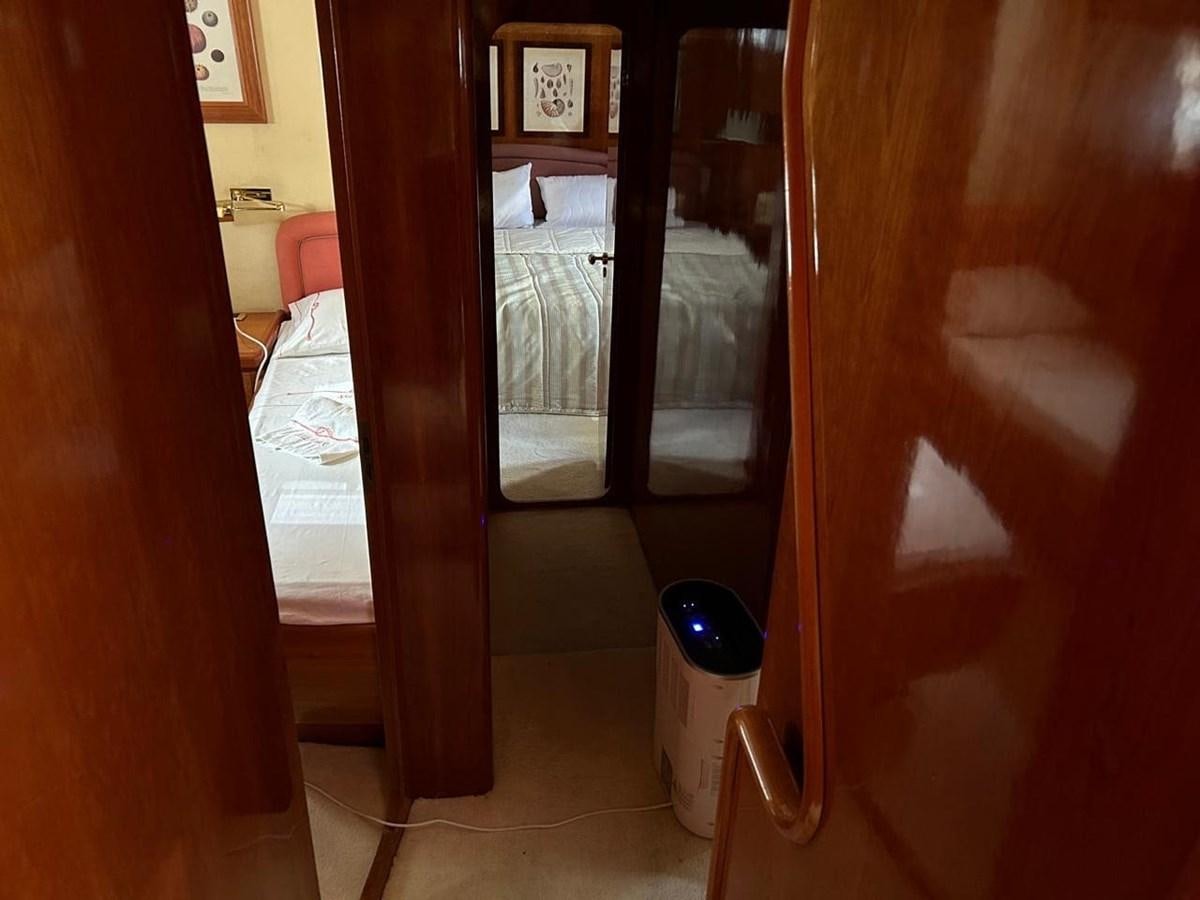 a room with a glass door aboard MILMAR Yacht for Sale