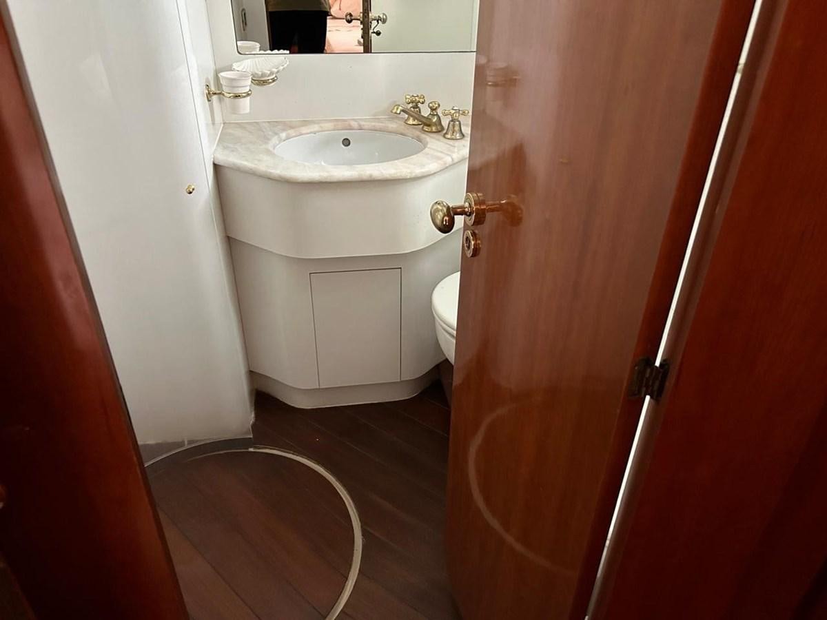 a bathroom with a sink and a toilet aboard MILMAR Yacht for Sale
