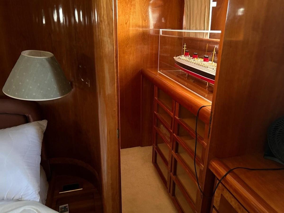 a room with a piano and a lamp aboard MILMAR Yacht for Sale