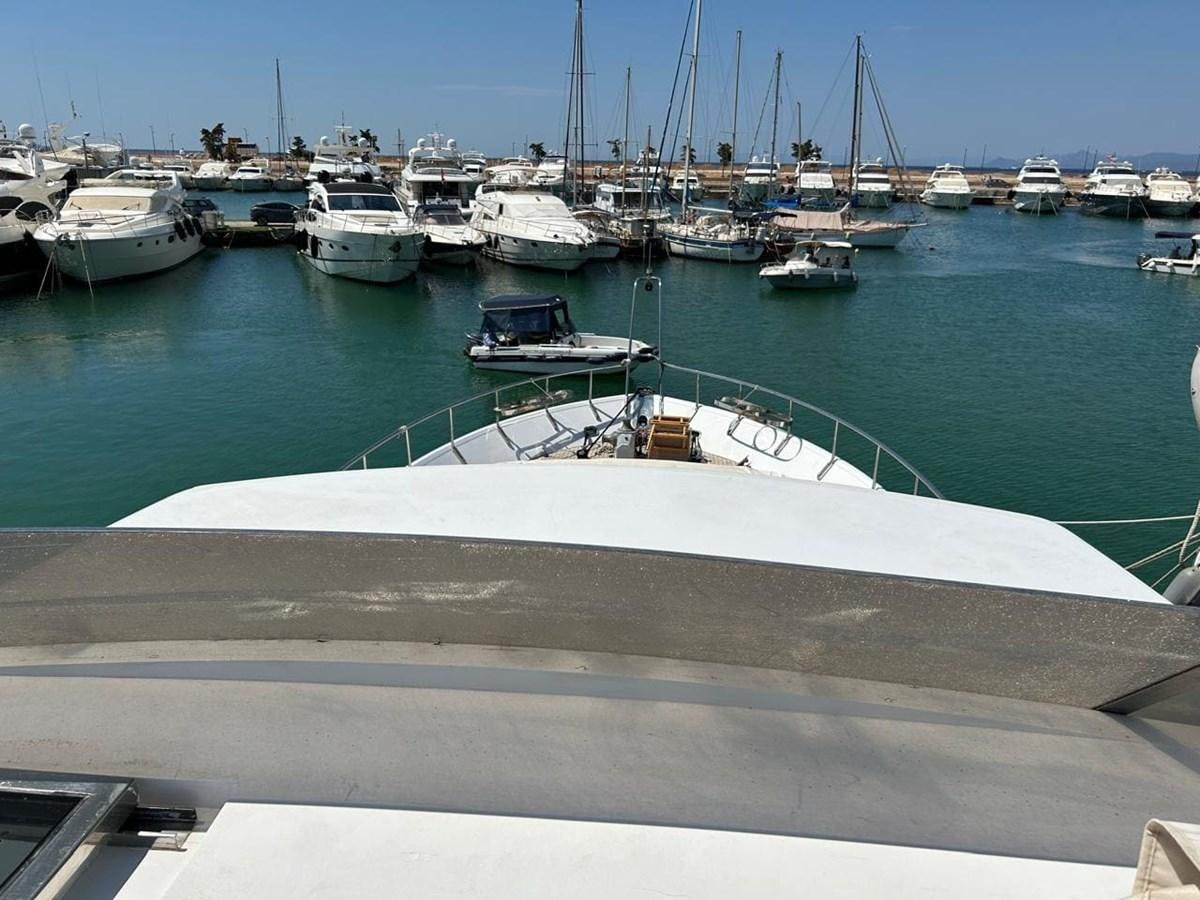 a group of boats in a harbor aboard MILMAR Yacht for Sale