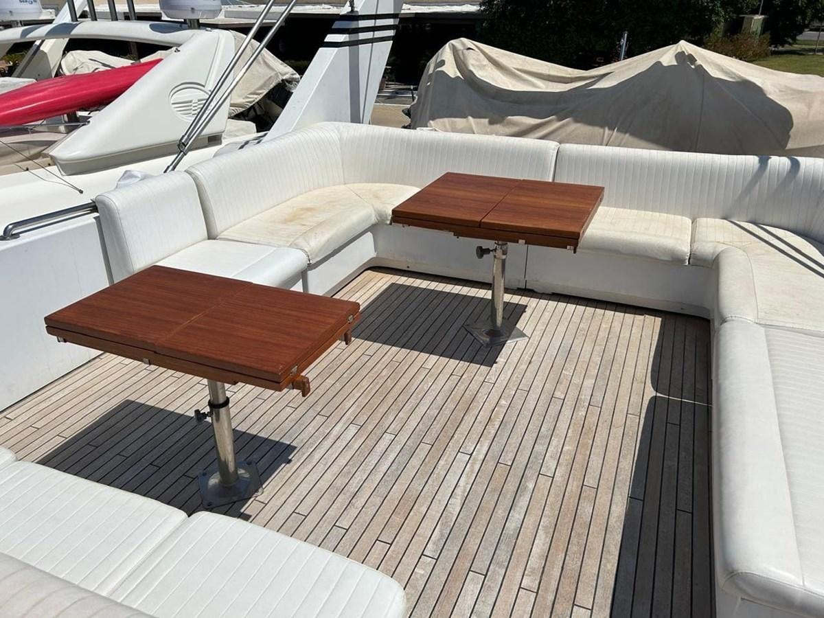 a table and chairs on a boat aboard MILMAR Yacht for Sale