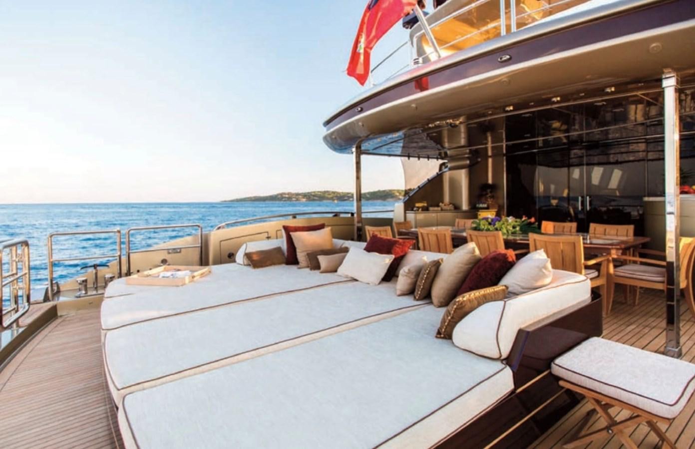 a large bed on a deck aboard GENESIS Yacht for Sale