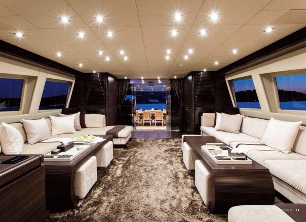 a room with a couch and a table aboard GENESIS Yacht for Sale