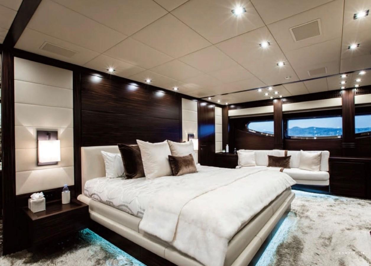 a room with a bed and a television aboard GENESIS Yacht for Sale