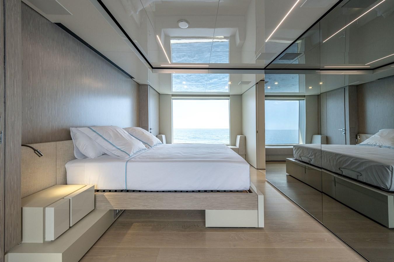 a room with a couple of beds aboard RSY C.129 Yacht for Sale