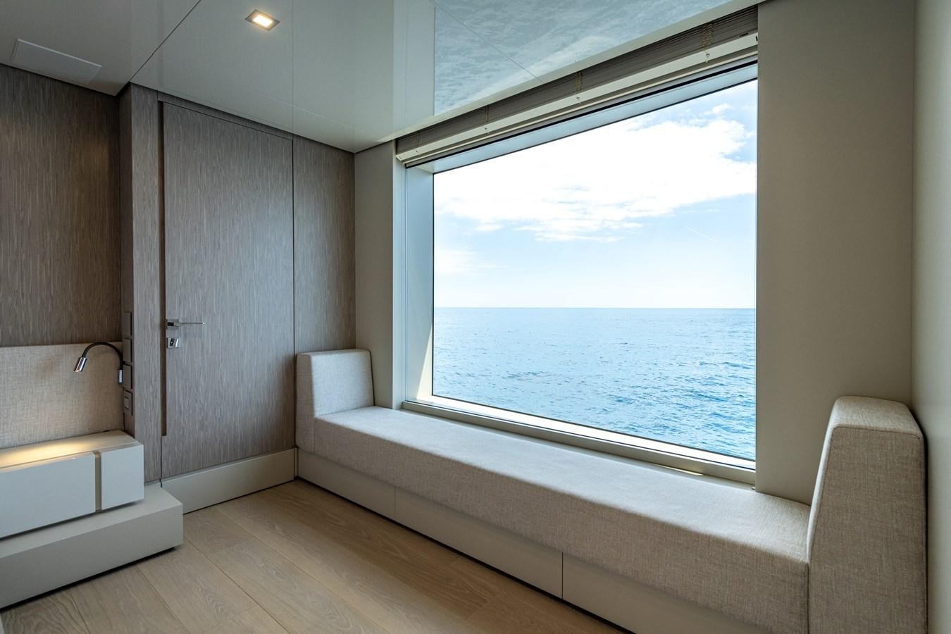 a room with a window and a bathtub aboard RSY C.129 Yacht for Sale
