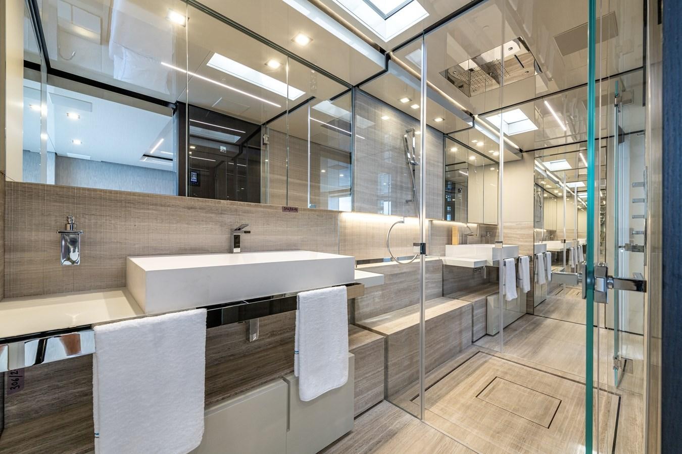 a bathroom with a large tub aboard RSY C.129 Yacht for Sale