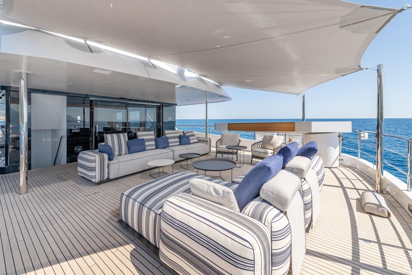 a large room with a deck and a pool aboard RSY C.129 Yacht for Sale