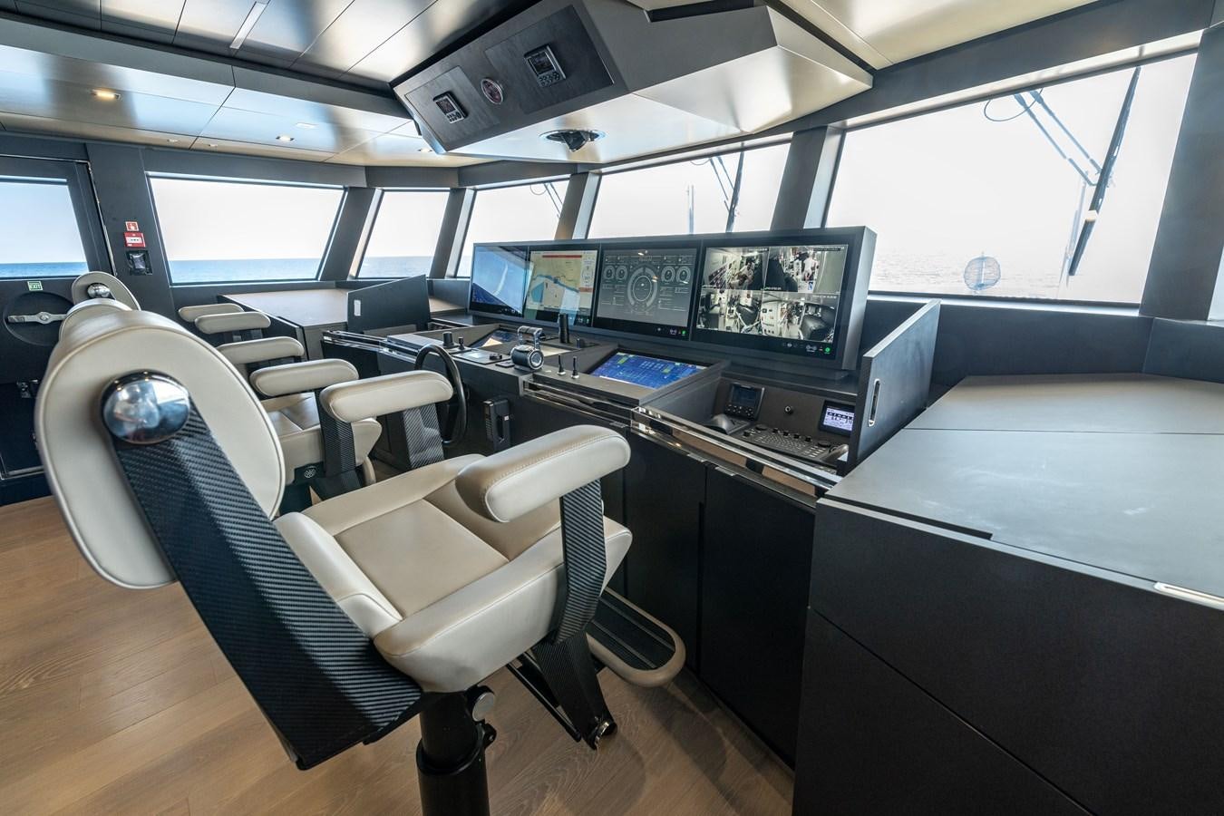 a room with many computers and monitors aboard RSY C.129 Yacht for Sale