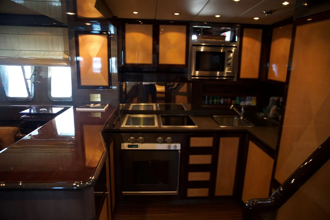 a kitchen with wooden cabinets aboard SILVER SKY Yacht for Sale