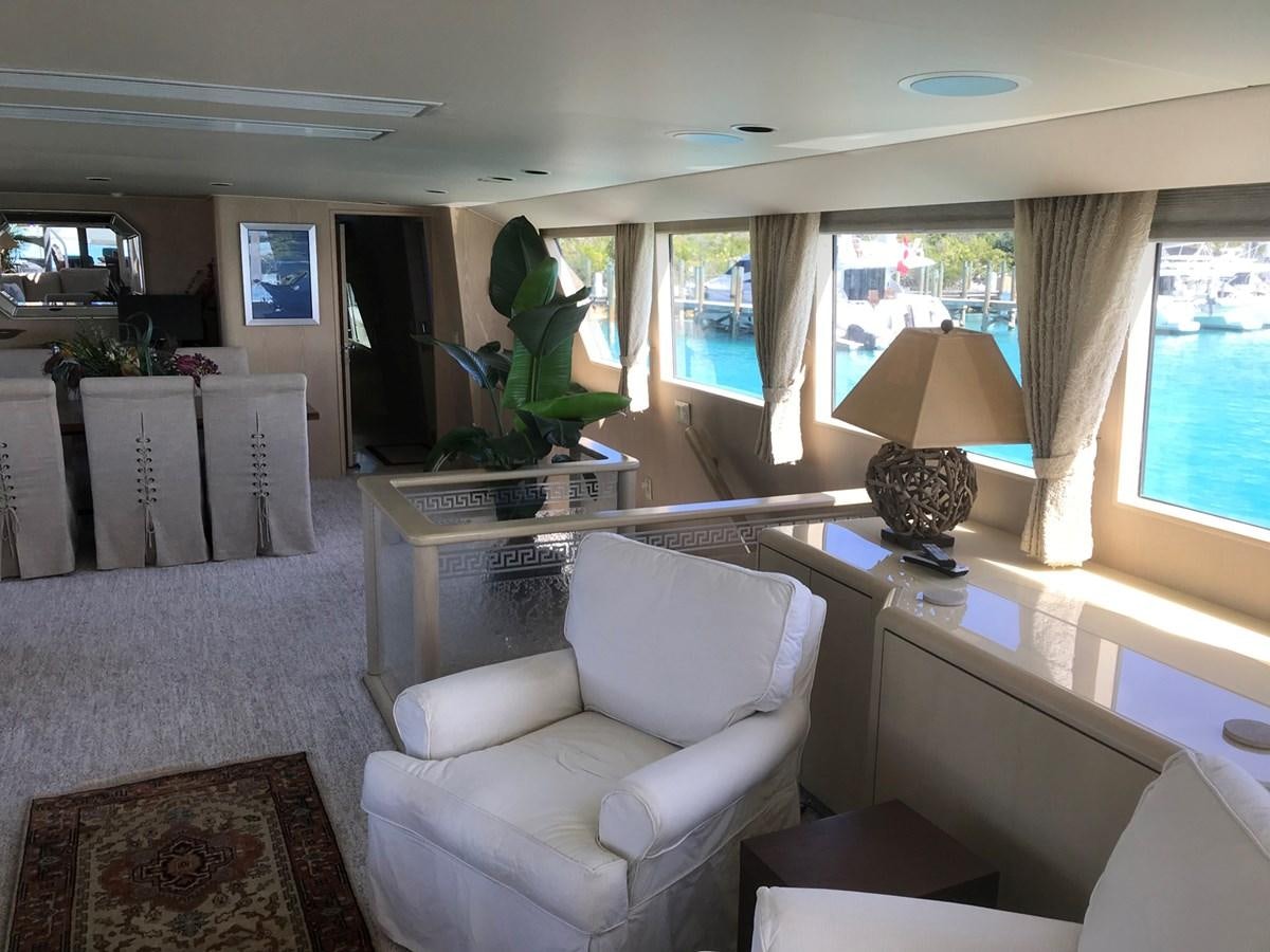 a living room with a large window aboard MON SHERI Yacht for Sale