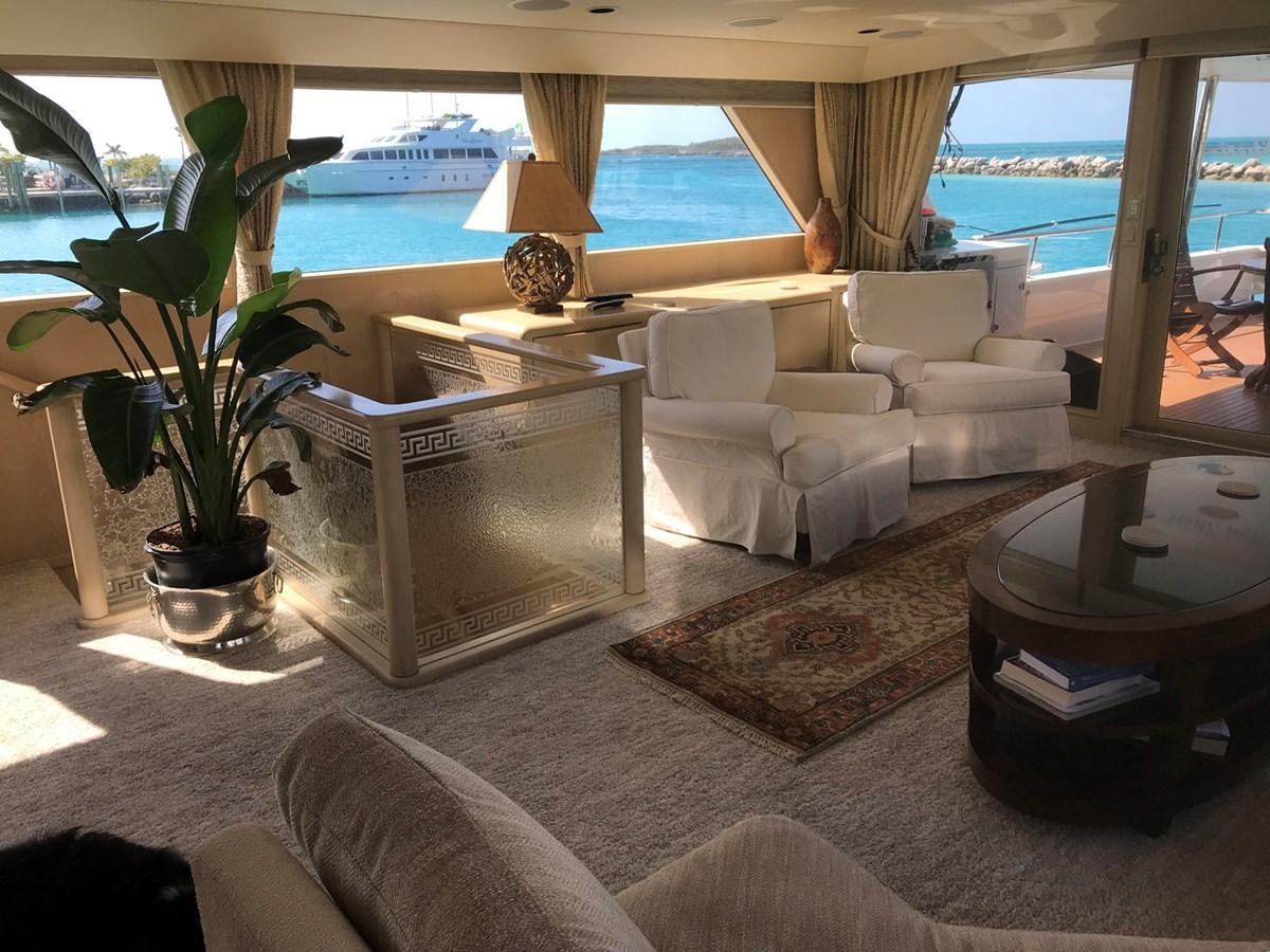 a living room with a large window aboard MON SHERI Yacht for Sale