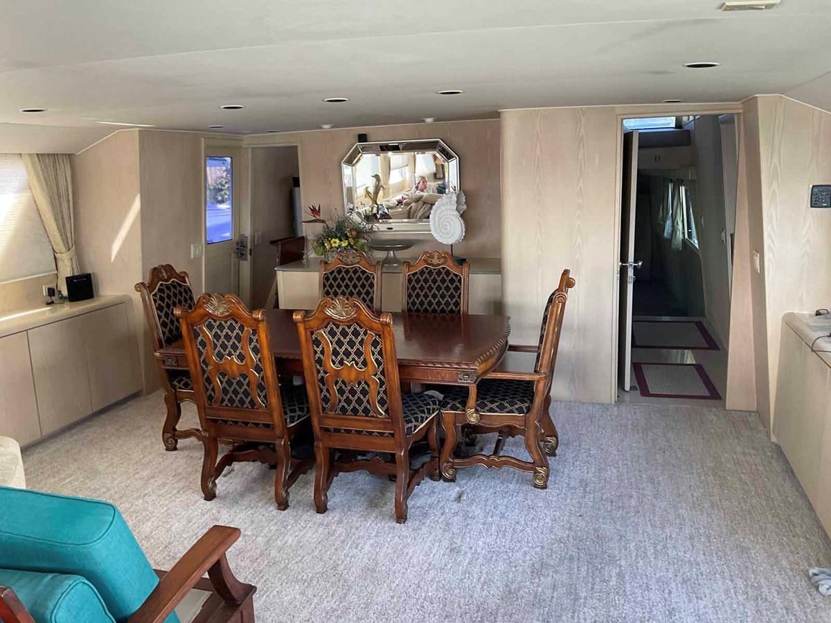 a dining room with chairs aboard MON SHERI Yacht for Sale