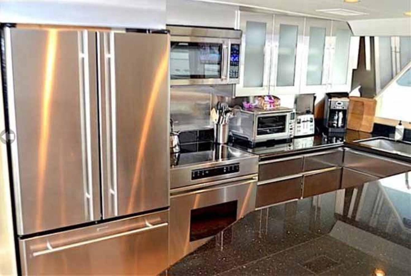 a kitchen with stainless steel appliances aboard MON SHERI Yacht for Sale