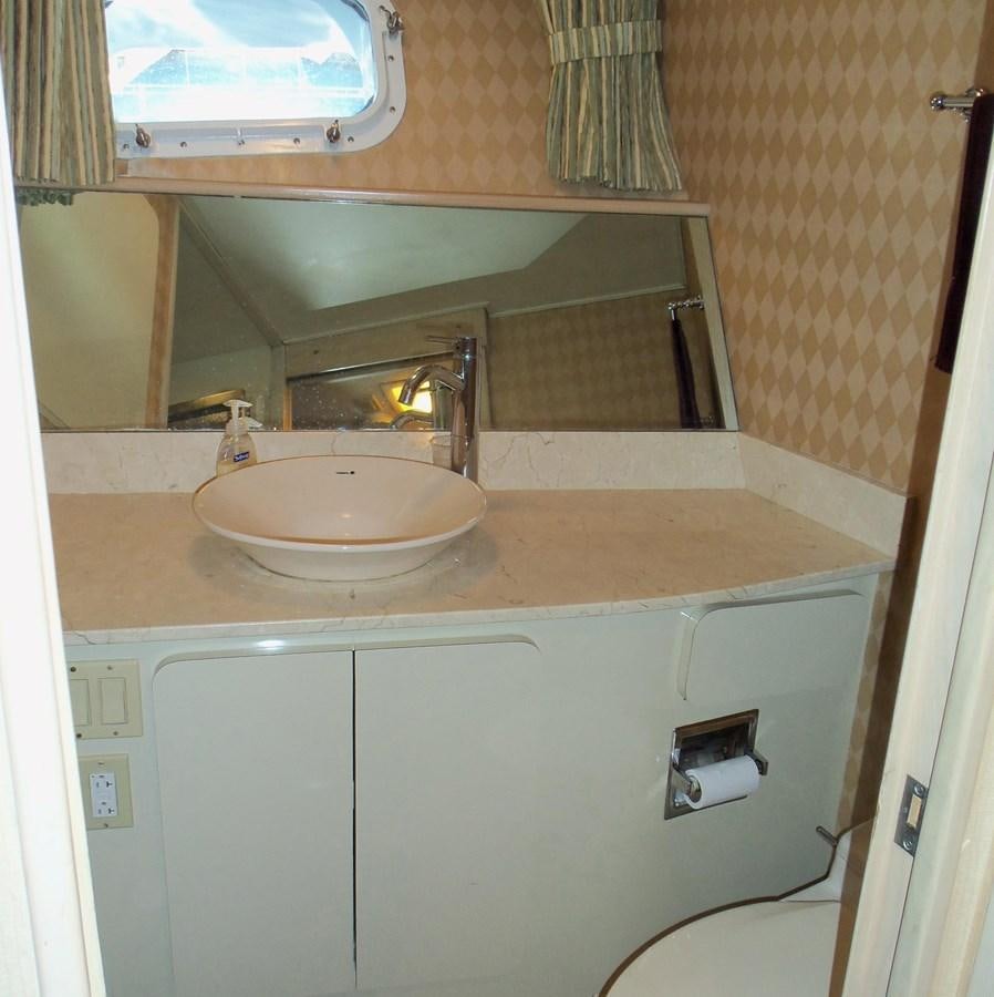 a bathroom with a sink and a mirror aboard MON SHERI Yacht for Sale