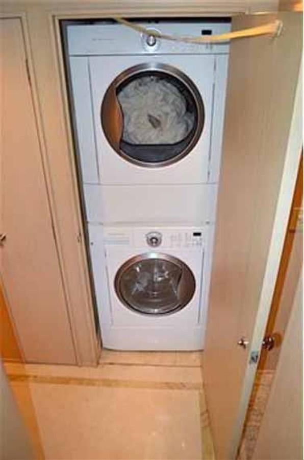 a washing machine in a closet aboard MON SHERI Yacht for Sale