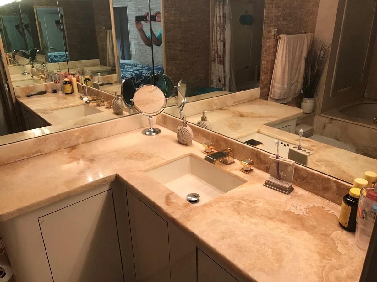 a bathroom with a large mirror aboard MON SHERI Yacht for Sale