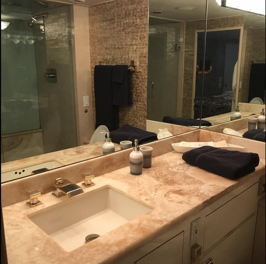 a bathroom with a large mirror aboard MON SHERI Yacht for Sale