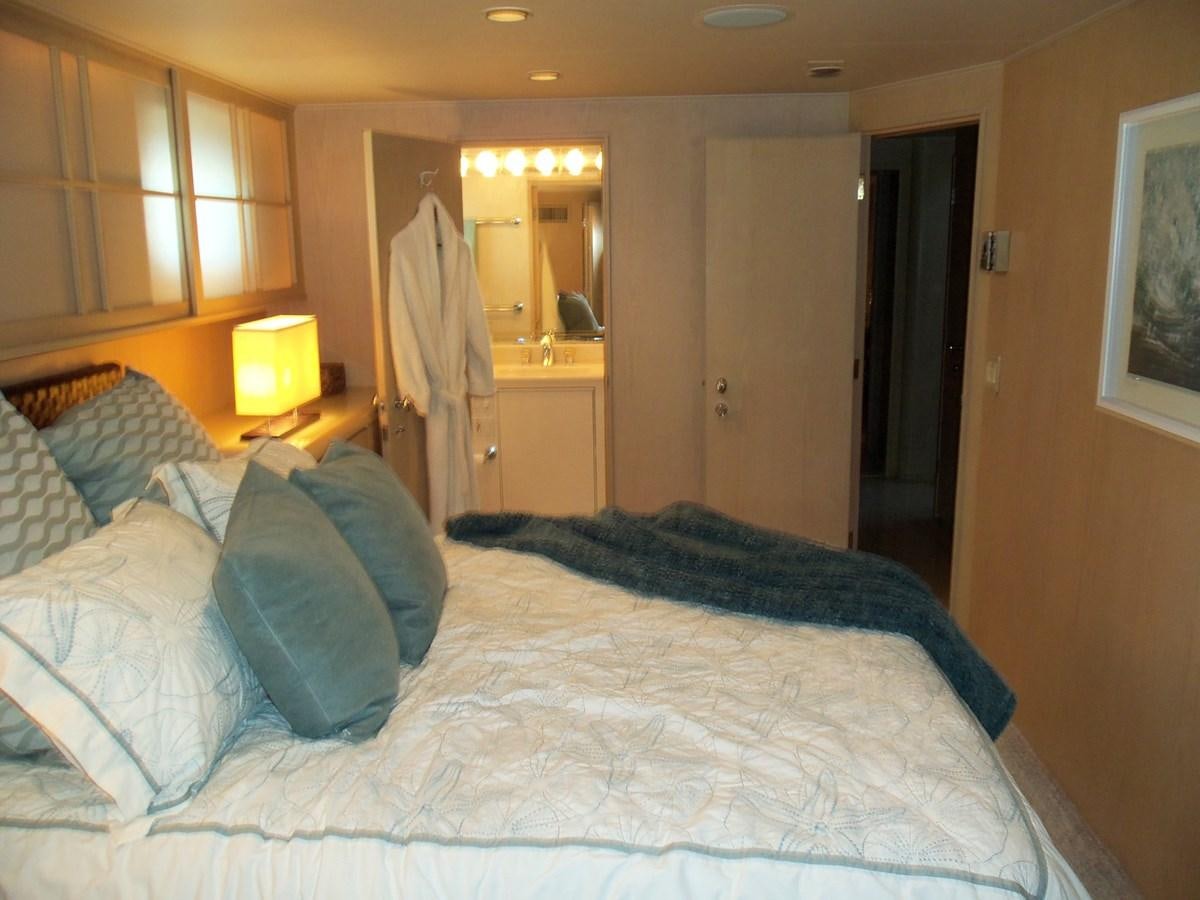 a bed in a bedroom aboard MON SHERI Yacht for Sale