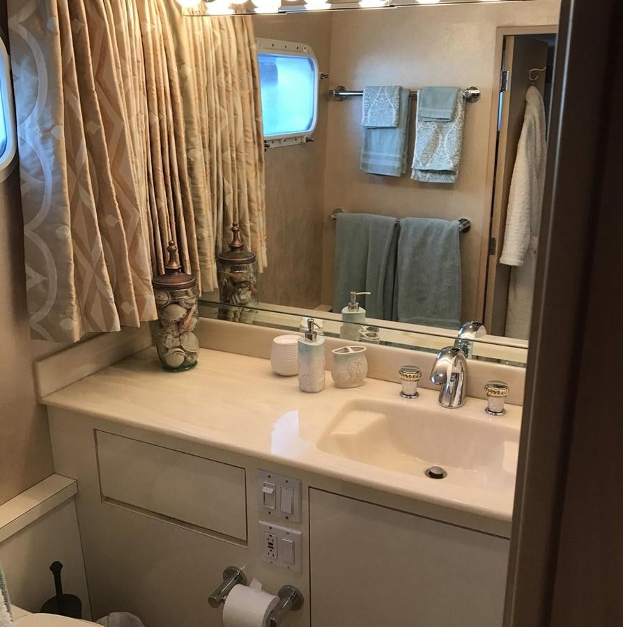 a bathroom with a large mirror aboard MON SHERI Yacht for Sale
