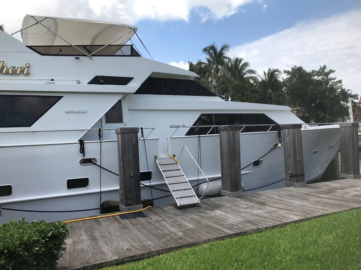 a white building with a staircase aboard MON SHERI Yacht for Sale