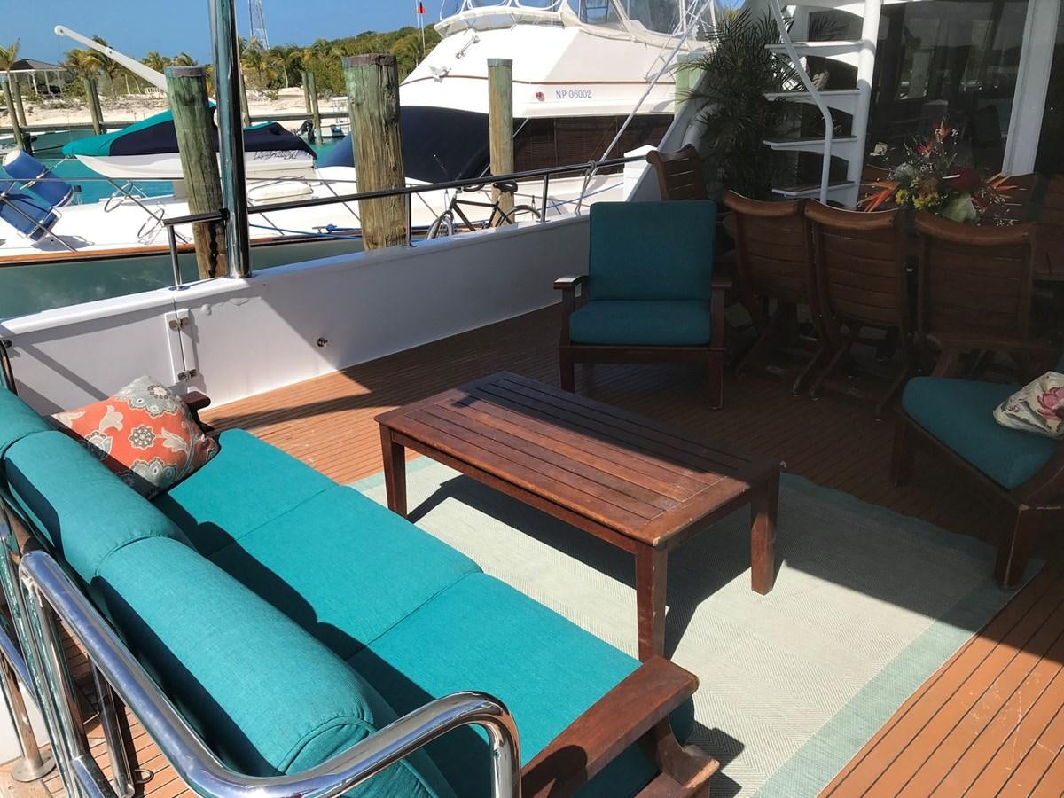a deck with chairs and tables aboard MON SHERI Yacht for Sale