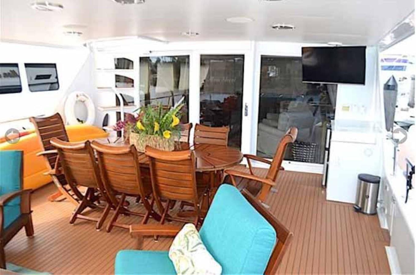 a room with tables and chairs aboard MON SHERI Yacht for Sale