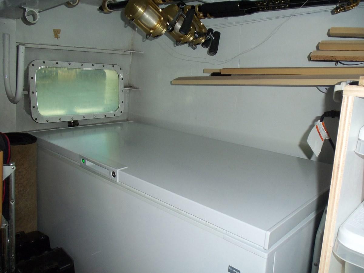 a white counter top with a window aboard MON SHERI Yacht for Sale