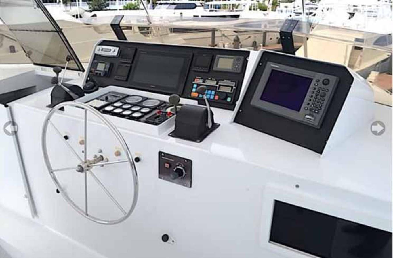 a white table with black electronic devices aboard MON SHERI Yacht for Sale