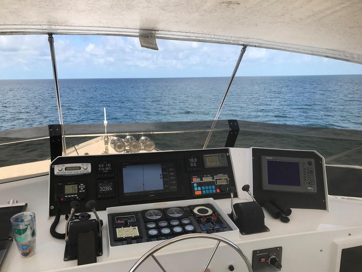 a boat with multiple monitors and a couple of screens on the deck aboard MON SHERI Yacht for Sale