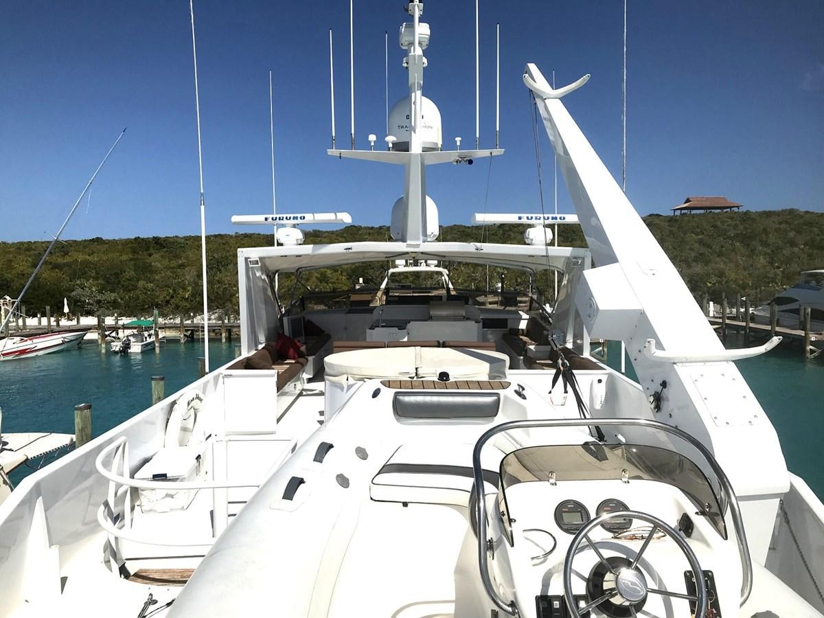 a white boat with a white sail aboard MON SHERI Yacht for Sale