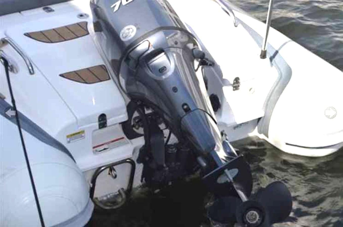 a white plane with a black nose aboard MON SHERI Yacht for Sale