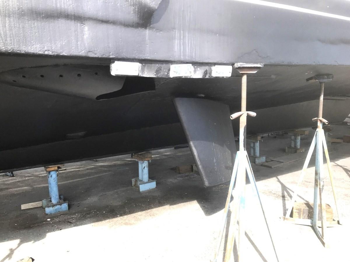 a black car with a black hood aboard MON SHERI Yacht for Sale