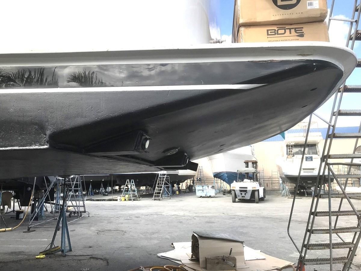 a large airplane being repaired aboard MON SHERI Yacht for Sale