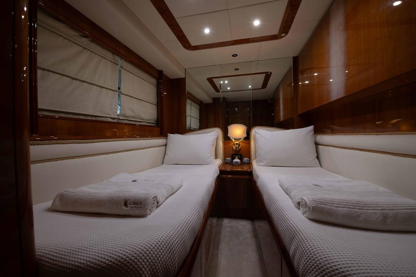 a room with two beds aboard STOLI Yacht for Sale
