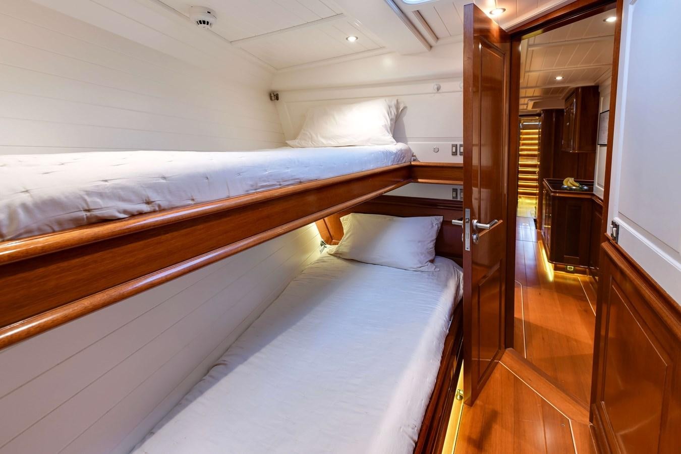a room with a bed and a door aboard ATALANTE Yacht for Sale