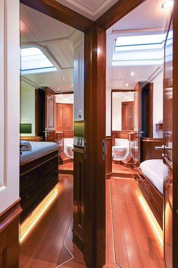 a bathroom with a wood floor aboard ATALANTE Yacht for Sale