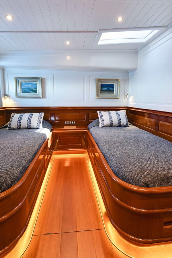 a large room with a wood floor aboard ATALANTE Yacht for Sale