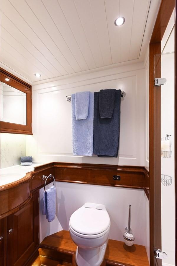 a bathroom with a toilet and towels aboard ATALANTE Yacht for Sale