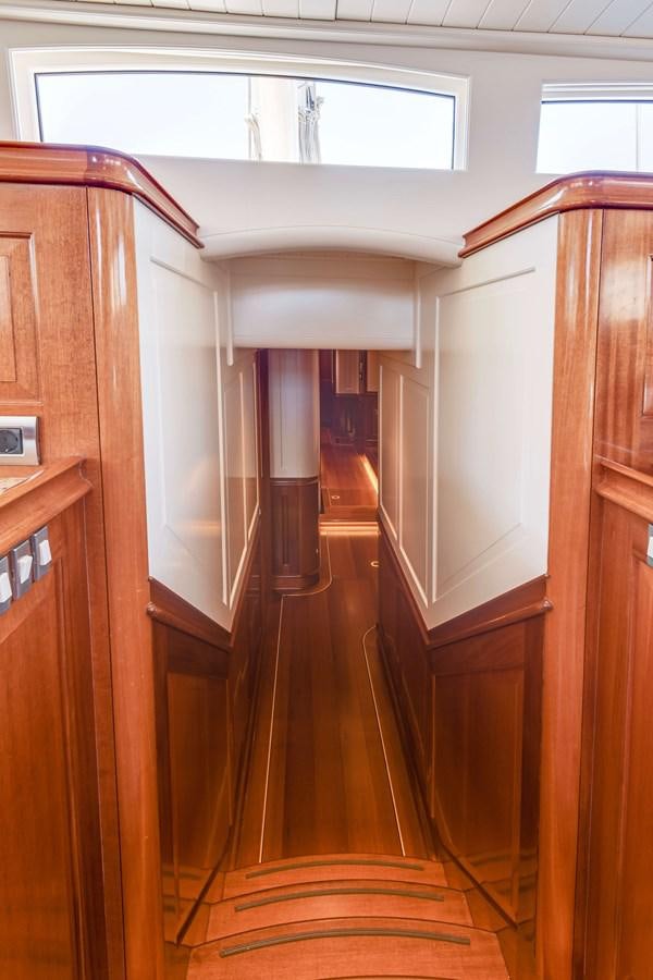 a hallway with wooden doors aboard ATALANTE Yacht for Sale