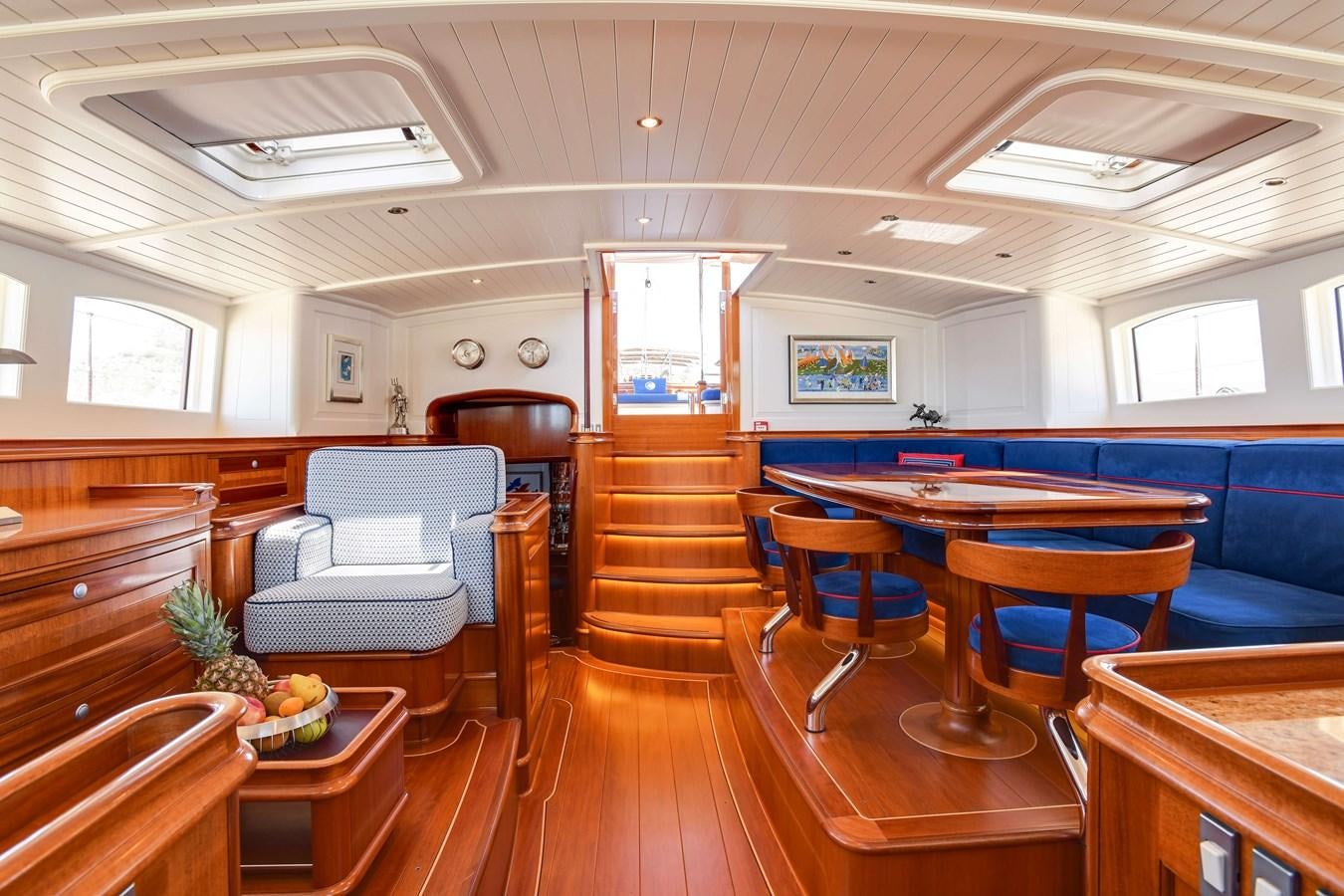 a room with tables and chairs aboard ATALANTE Yacht for Sale