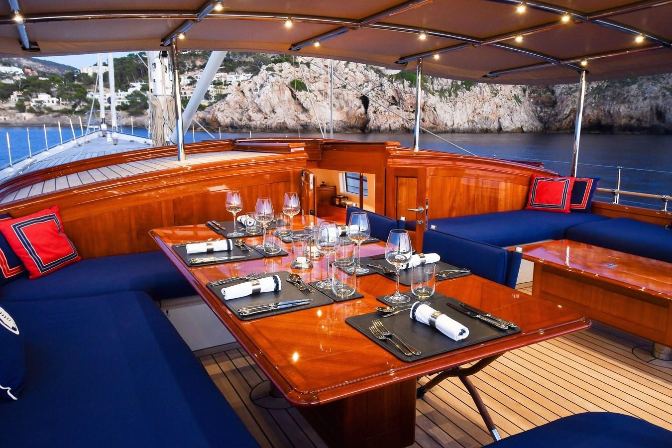 a table with glasses and a cloth aboard ATALANTE Yacht for Sale