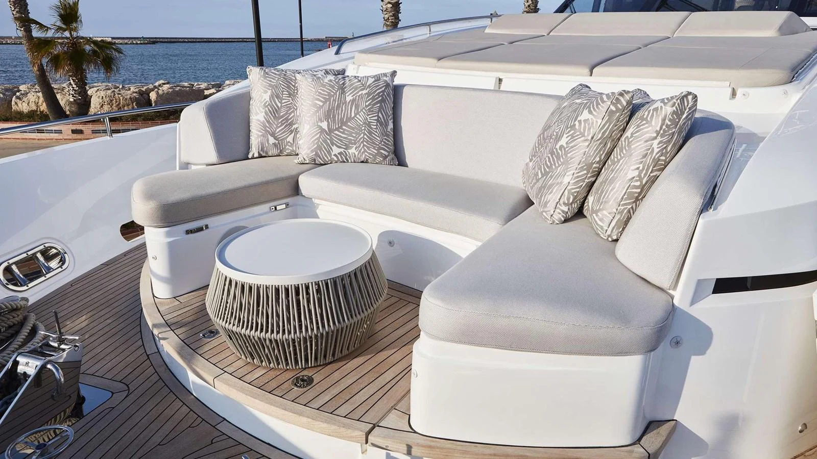 a white couch with a white pillow on it aboard GHOST Yacht for Sale