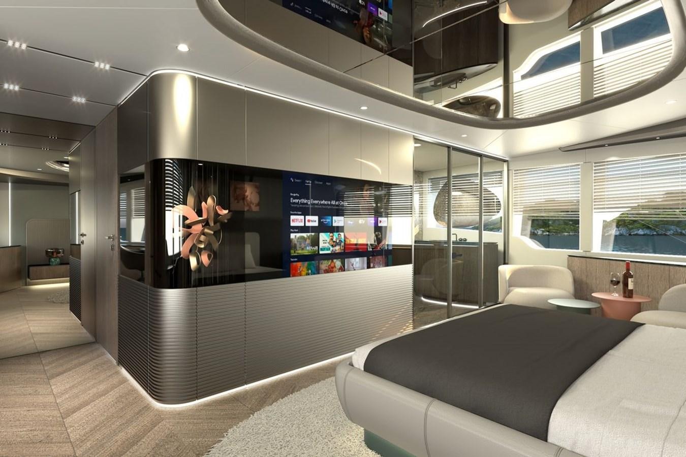 a room with a couch and a tv on the wall aboard KANDO 85 Yacht for Sale