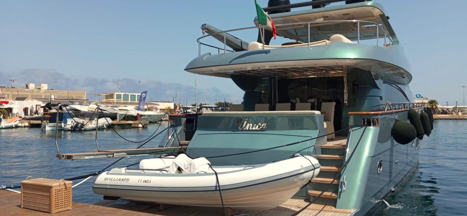 boats docked at a pier aboard UNICA Yacht for Sale