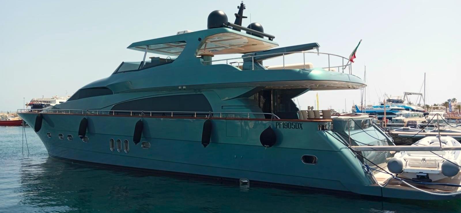 a large blue boat aboard UNICA Yacht for Sale
