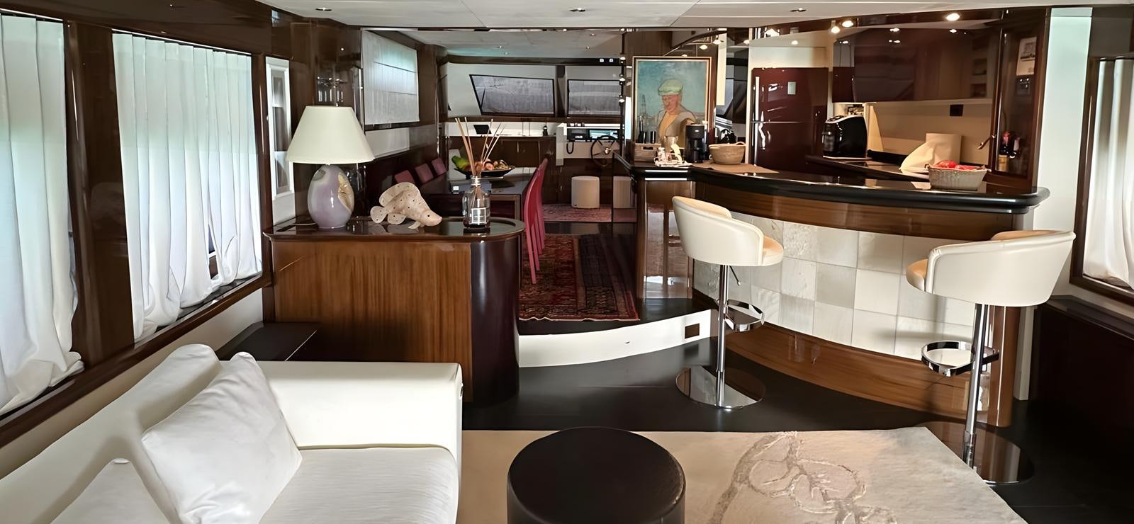 a room with a table chairs and a window aboard UNICA Yacht for Sale